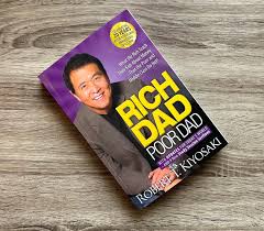 Rich Dad Poor Dad is a 1997 book written by Robert T. Kiyosaki and Sharon Lechter. It advocates the importance of financial literacy, financial independence and building wealth through investing in assets, real estate investing, starting and owning businesses, as well as increasing one's financial intelligence.